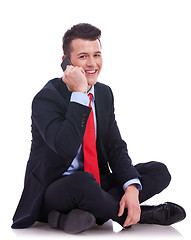 Image showing seated businessman talking on the phone