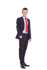 Image showing business man standing with hand in pocket 