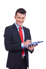 Image showing Casual Business man With a Clipboard 