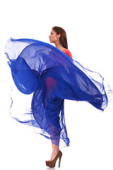 Image showing beautiful woman in blue waving flying dress 