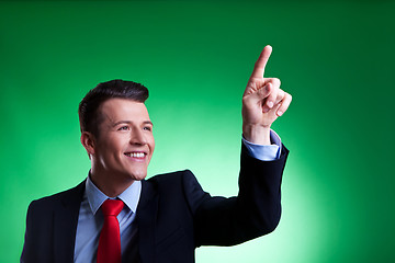 Image showing business man pushing imaginary digital buttons