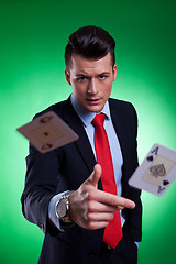 Image showing young business man throwing the winning hand 