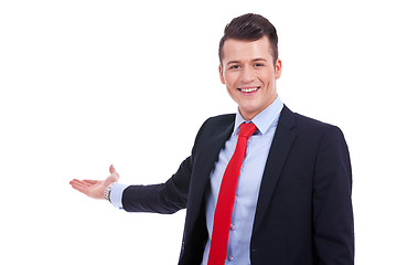Image showing Happy business man presenting