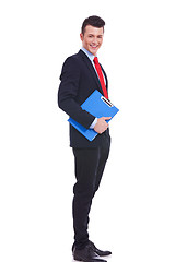 Image showing young business man with a blue clipboard