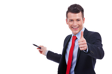 Image showing business man presenting something and giving the ok for it