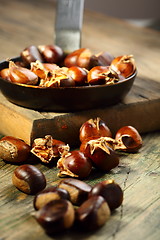 Image showing Frying pan and roast chestnuts.