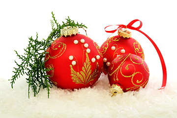 Image showing Christmas red balls on the snow.