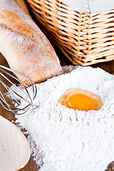 Image showing  bread, flour, eggs and kitchen utensil