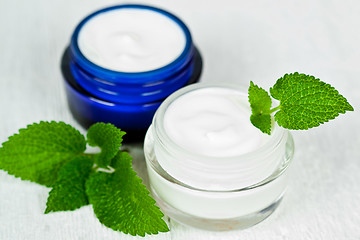 Image showing face cream in jars with urtica 
