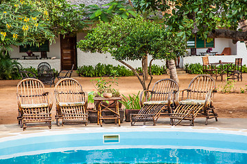 Image showing Chairs on swimming pool border