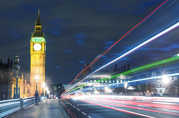 Image showing Tower Bridge in London, UK at night with traffic and moving red 