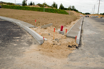 Image showing road construction site car go light pole wires 