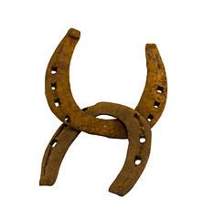 Image showing Crossed retro rusty two horseshoes on white 