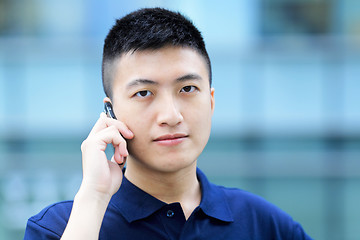 Image showing asian man with cell phone