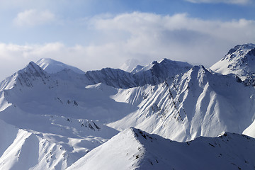 Image showing Snowy mountains in clouds