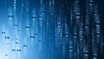 Image showing motion blue water drops in the rain