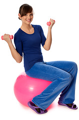 Image showing Exercises with dumbbells on a gymnastic ball