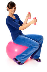 Image showing Exercises with dumbbells on a gymnastic ball