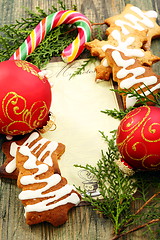 Image showing Christmas balls, gingerbread and candy cane.