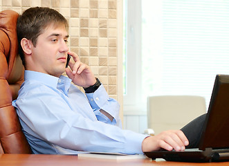 Image showing Man in the office talking by phone