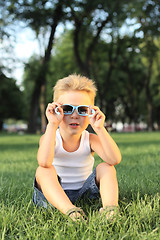 Image showing Little boy sitting in the park