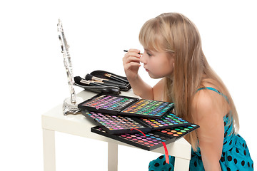 Image showing Little girl paints his face makeup