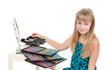 Image showing Little girl paints his face makeup