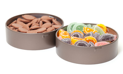 Image showing Colorful Jelly and Chocolate Candies in tin cans