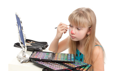 Image showing Little girl paints his face makeup