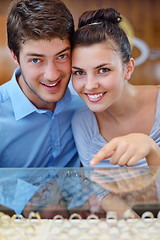 Image showing happy young couple in jewelry store