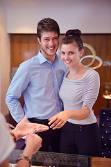 Image showing happy young couple in jewelry store