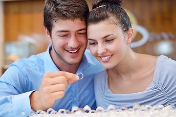 Image showing happy young couple in jewelry store