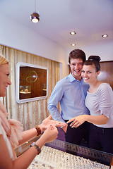 Image showing happy young couple in jewelry store