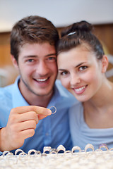 Image showing happy young couple in jewelry store