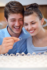 Image showing happy young couple in jewelry store