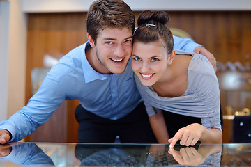 Image showing happy young couple in jewelry store