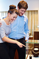 Image showing happy young couple in jewelry store