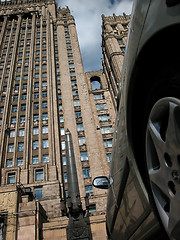 Image showing wheel and sky-scraper