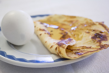 Image showing Boiled eggs and pancake