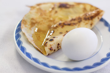 Image showing Boiled eggs and pancake