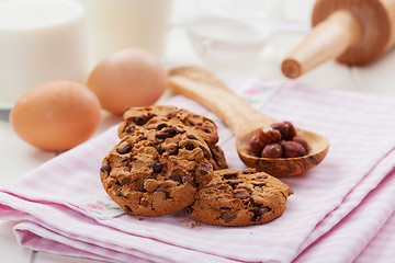 Image showing Christmas chocolate and nut cookies with glass of milk