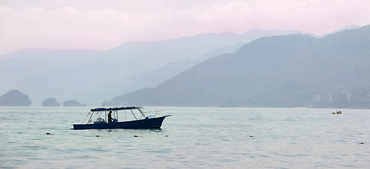 Image showing Fisherman at sunrise