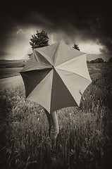 Image showing Woman with colorful Umbrella in Tuscany Spring Countryside