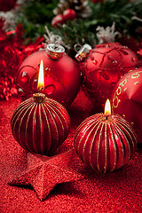 Image showing Christmas candles and balls in red