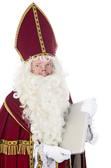 Image showing Sinterklaas using a laptop