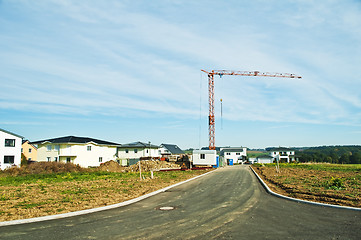 Image showing houses estate with crane