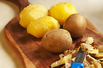 Image showing peeling potatoes
