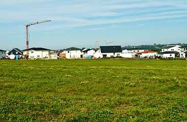 Image showing houses estate with crane