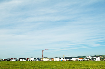 Image showing houses estate with crane