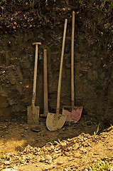 Image showing hole with shovel,spade and hoe